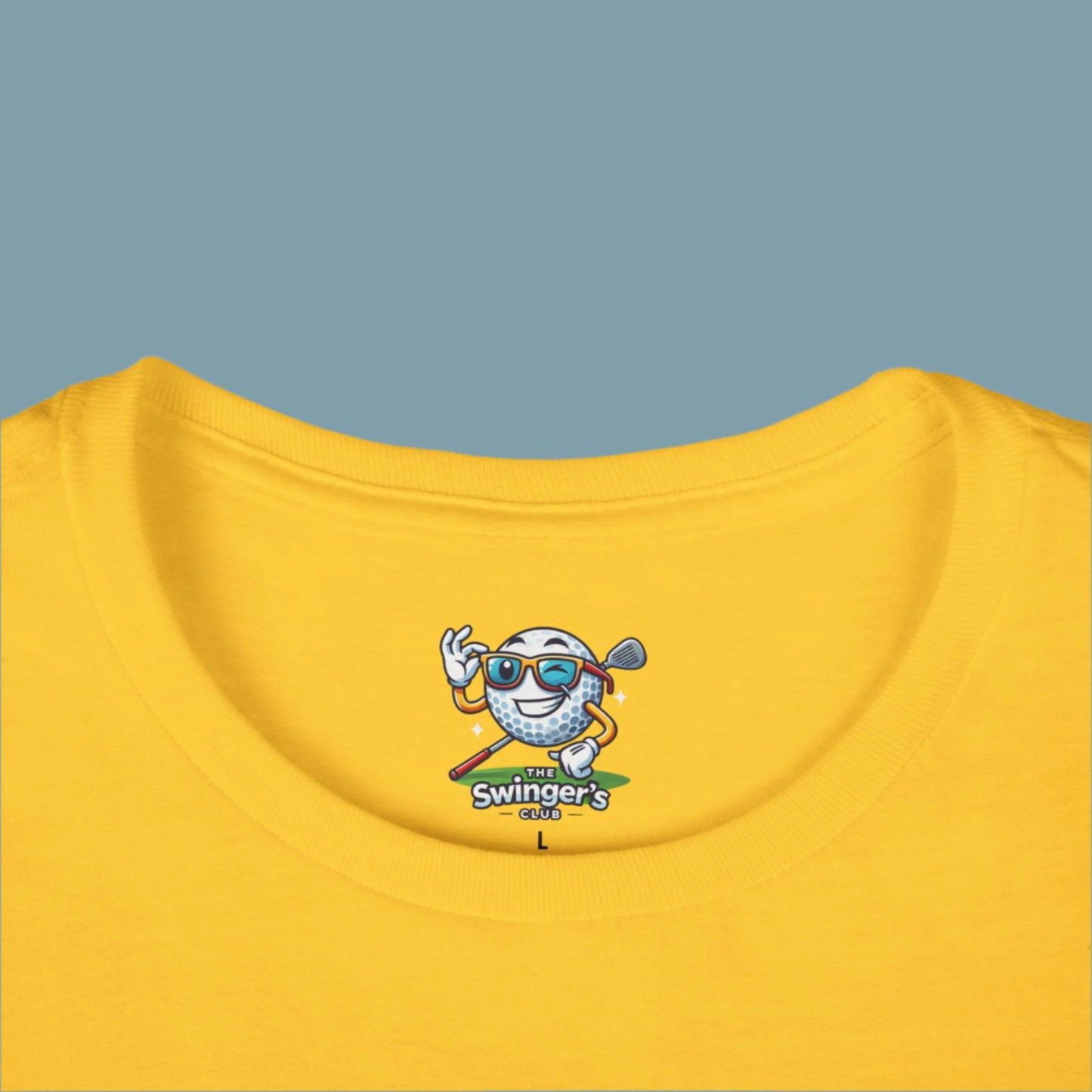 Yellow t-shirt with a cartoon golf ball character and 'The Swingers Club' logo on a white background