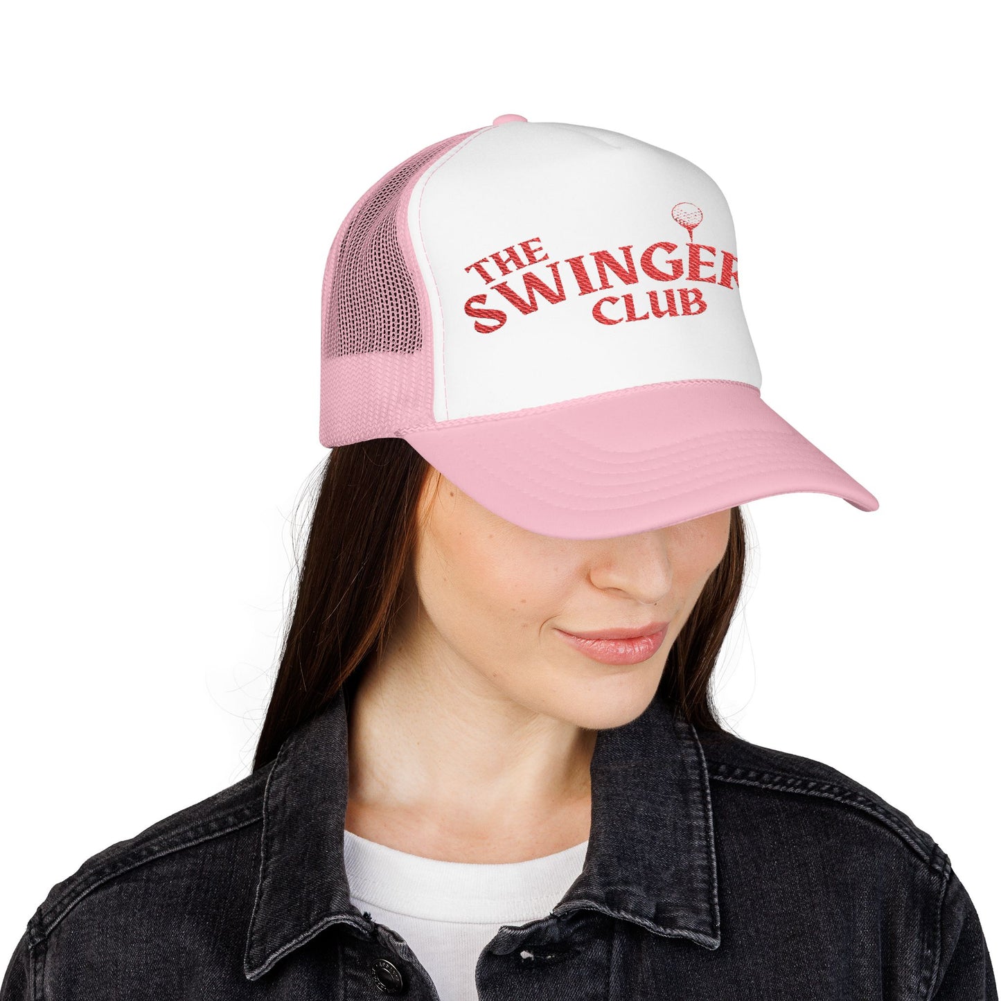 Pink foam trucker hat with the text "The Swinger's Club" on the front worn by a female model