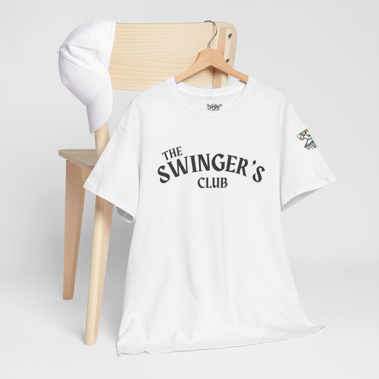 White t-shirt with 'The Swinger's Club' text on a wooden chair against a white background