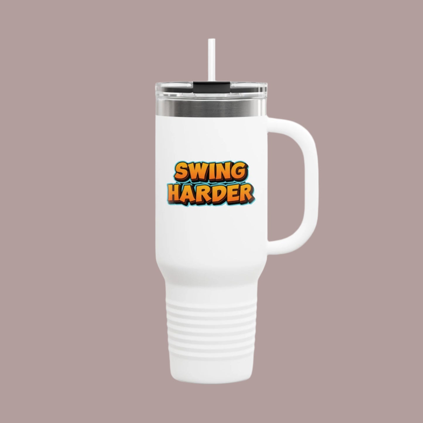 White travel mug with 'SWING HARDER' text on a tan background